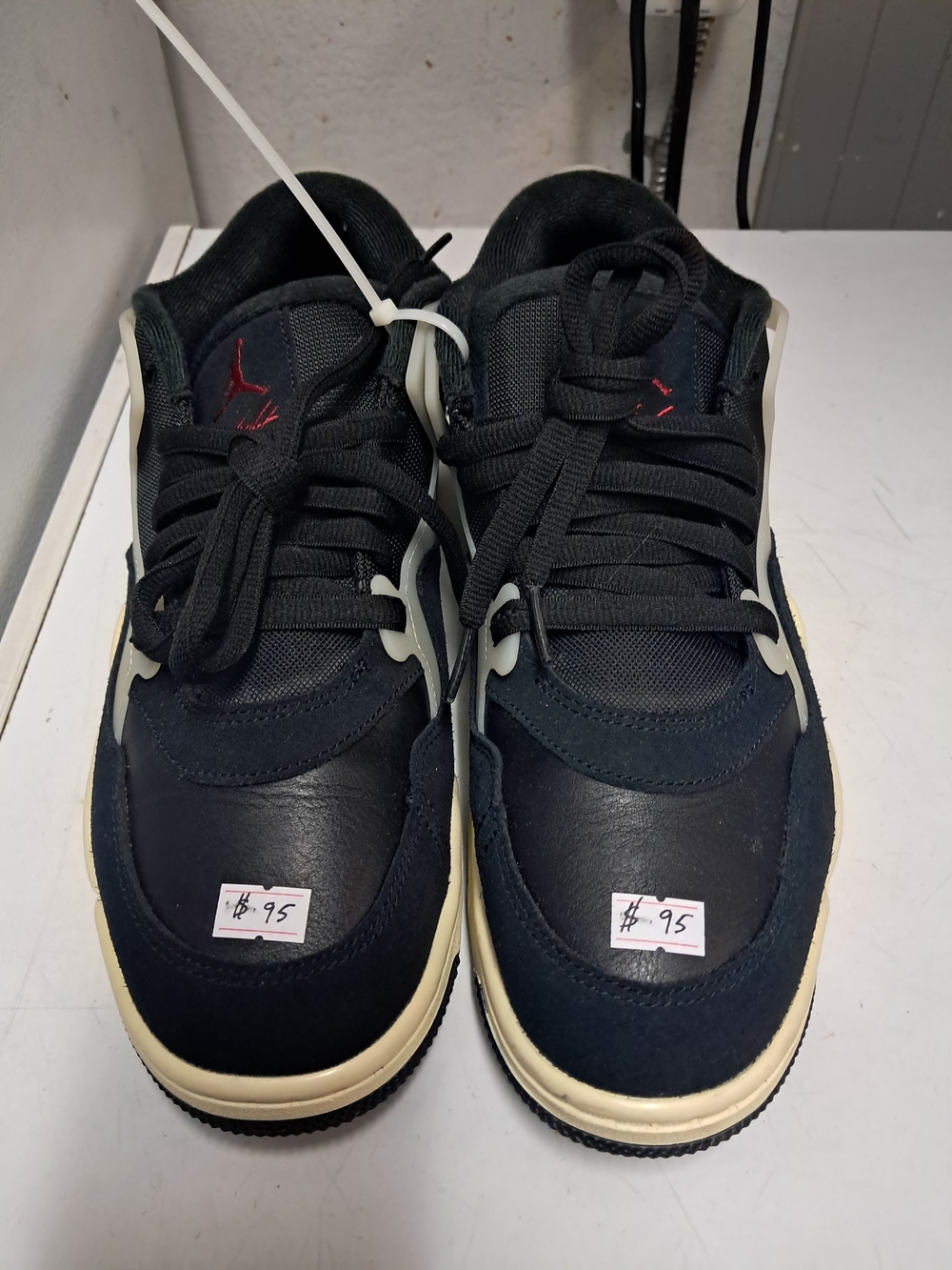 Nike Black Sneakers with Cream Midsole and Red Logo